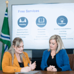 Two BECN staff members sitting at a table.